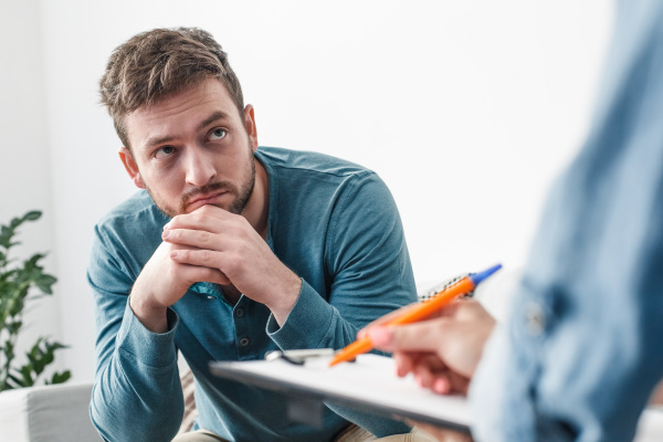 man listening to therapist intently