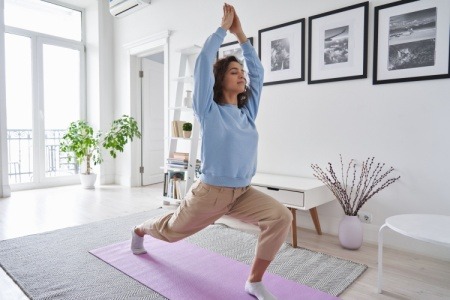 woman doing yoga to control her anger